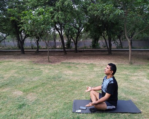 Man practicing deep breathing exercises and mindfulness outdoors